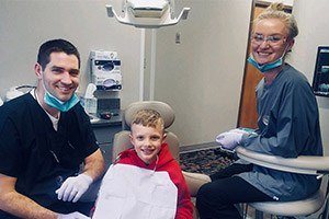 Hygienists working with young patient