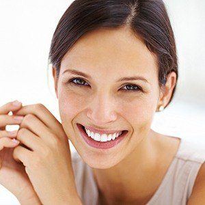 Woman with gorgeous smile after cosmetic dentistry