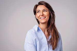 beautiful, young-looking woman in a striped shirt