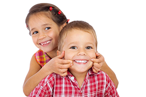 Kids smiling after children's dentistry treatment