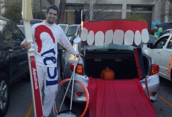 Dentist dressed as toothpaste at community event