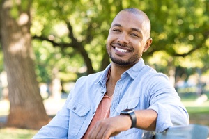 man smiling with confidence after deciding which treatment is right for him