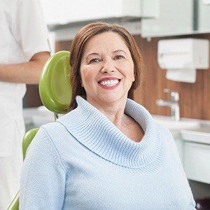 Smiling woman in dental chair during dental checkup