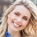 Woman with flawless smile after cosmetic dentistry