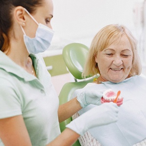 patient learning whether she’s a candidate for dentures