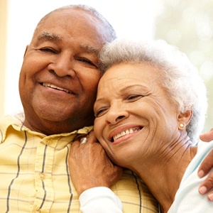 happy couple enjoying the benefits of dentures in Lincoln