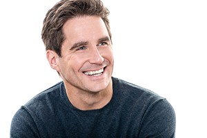 smiling man in a black shirt and white background