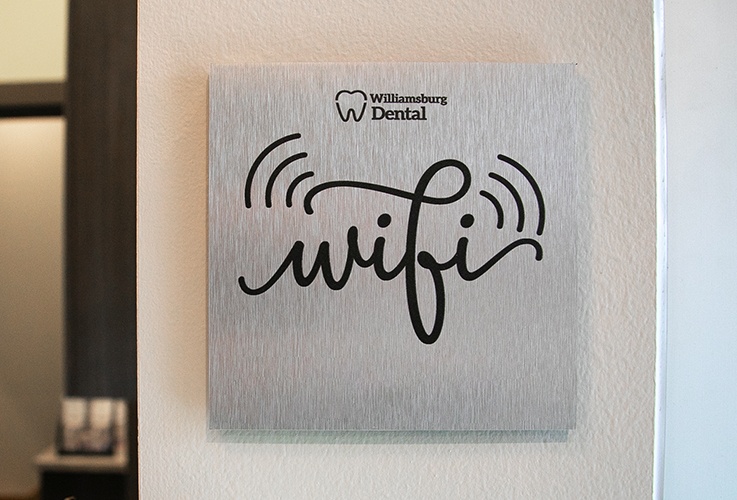 Metal sign reading Williamsburg Dental WiFi