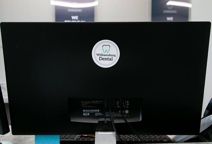 Williamsburg Dental logo sticker on computer monitor