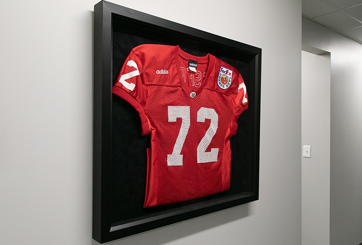 Jersey hanging on hallway wall