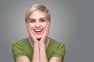 Healthy woman smiles after toothache treatment in Lincoln