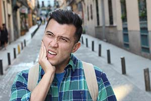 Man with toothache in Lincoln wondering about emergency dentistry