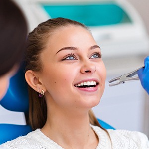 Woman smiling during tooth extractions