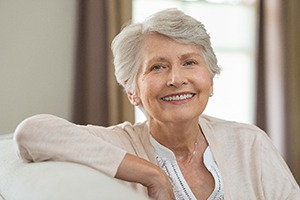 woman who has dental implants in Lincoln