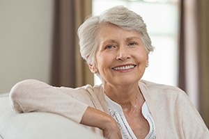 An older couple examining an X-ray fore dental implant tooth replacement