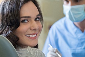 woman smiling after dental implant surgery