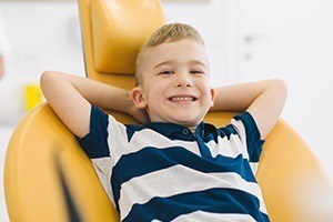 Smiling boy in dental chair for children's dentistry
