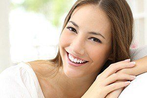 Young woman with beautiful smile after teeth whitening