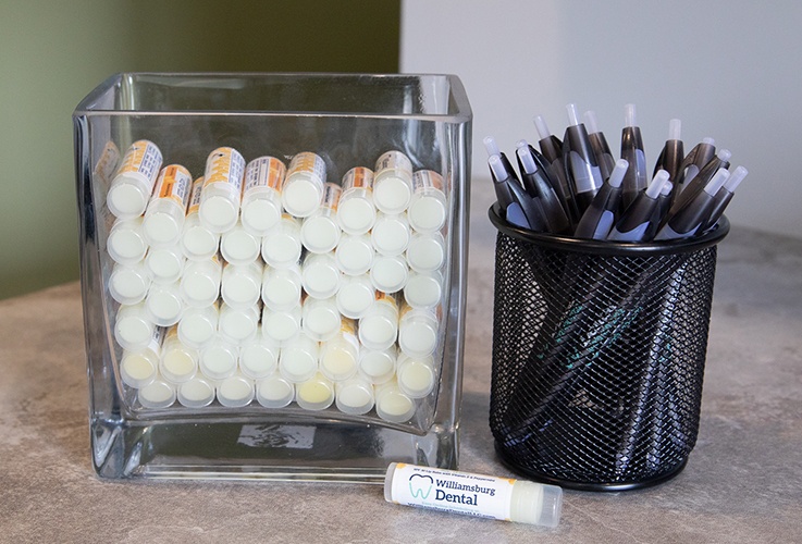 Pens and lip balms with Williamsburg Dental branding