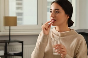 woman taking oral conscious sedation