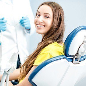 Smiling woman in dental chair for dental services in Piedmont dental office