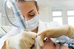 dentist performing root canal therapy (for Root Canal Process section)