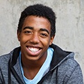 Young man smiling after wisdom tooth extraction