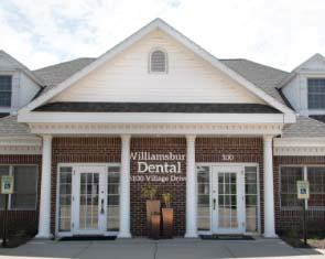 dental team member talking with patient