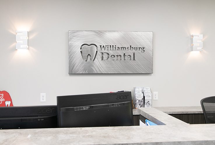 Williamsburg Dental sign behind front desk