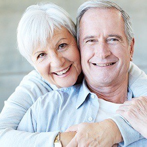 Smiling senior couple after restorative dentistry