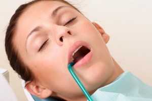 patient relaxed during a dental procedure thanks to the sedation dentist lincoln trusts
