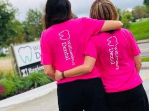 Two women hugging outside.