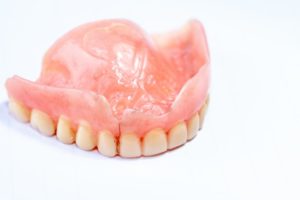 broken denture that needs an emergency dentist in Crete