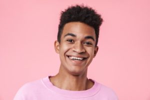 smiling teen after wisdom tooth extraction