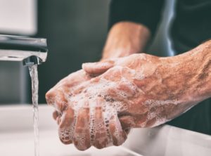 dentist in Lincoln washing hands