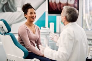 patient getting a dental exam for early detection of oral health problems