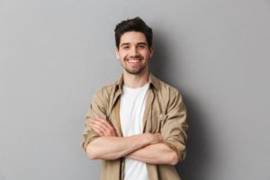 smiling young man with dentures