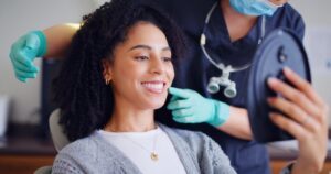 dentist examining a patient for teeth whitening